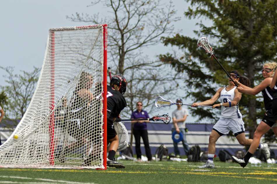Junior+attack+Kara+Mupo+scores+one+of+her+4+goals+Sunday+against+Louisville.+Mupos+timely+scoring+helped+Northwestern+keep+the+Cardinals+at+bay+in+the+second+half.