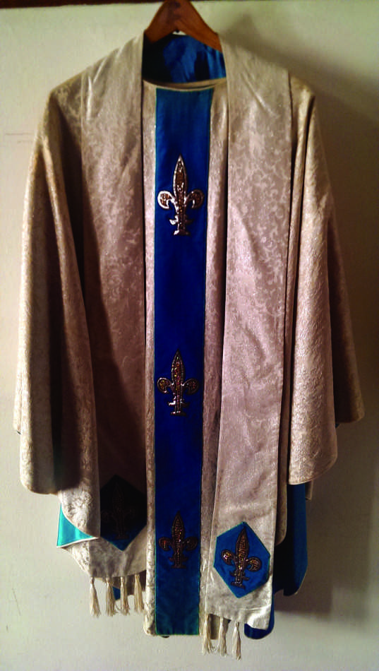 The+vestments+worn+by+St.+John+Paul+II+were+given+to+the+former+pope+during+a+trip+to+his+homeland+of+Poland+in+1997+by+Franciscan+sisters+who+wove+the+garment.+It+is+currently+on+display+at+St.+Athanasius+Parish%2C+1615+Lincoln+St.