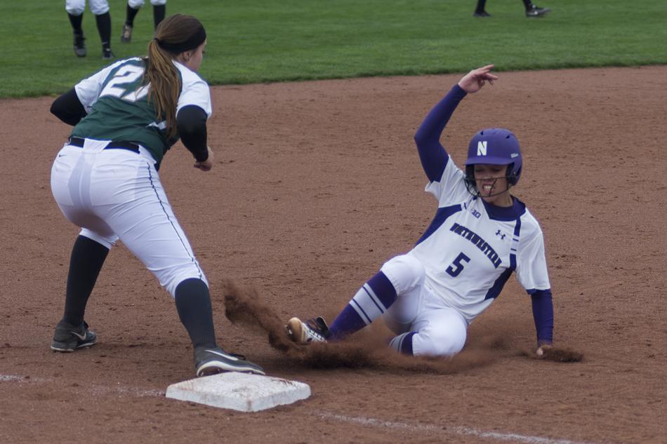 Senior pitcher Sammy Albanese slides into third base during Northwestern’s recent series against Michigan State. The Wildcats now head to Seattle for the opening round of the NCAA Tournament.