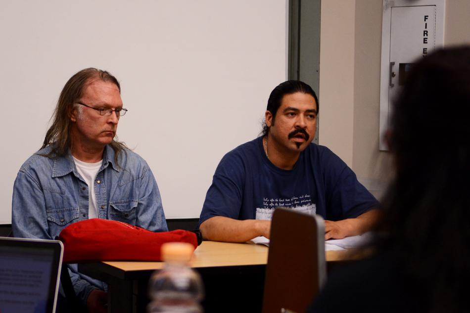 Tom Breitsprecher, a cook at the Willard Residential College dining hall, and Rafael Marquez, a food service worker in 1835 Hinman dining hall, discuss their personal experiences as campus workers at an event held Tuesday as part of Social Justice Week. At the end of the event, a petition supporting campus workers was announced. 