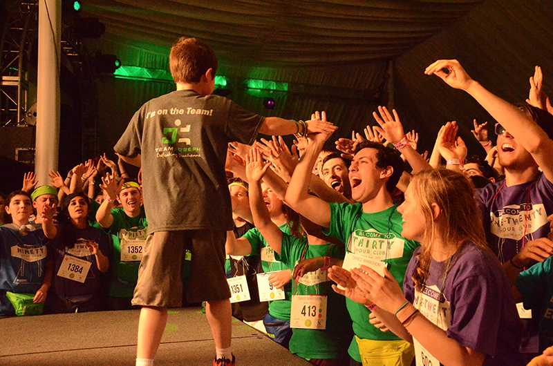 Joseph Penrod, the namesake of  Team Joseph, dances with students during Dance Marathon 2014. DMs executive board released a statement Monday night saying they are working to make the organization more inclusive for all NU students.