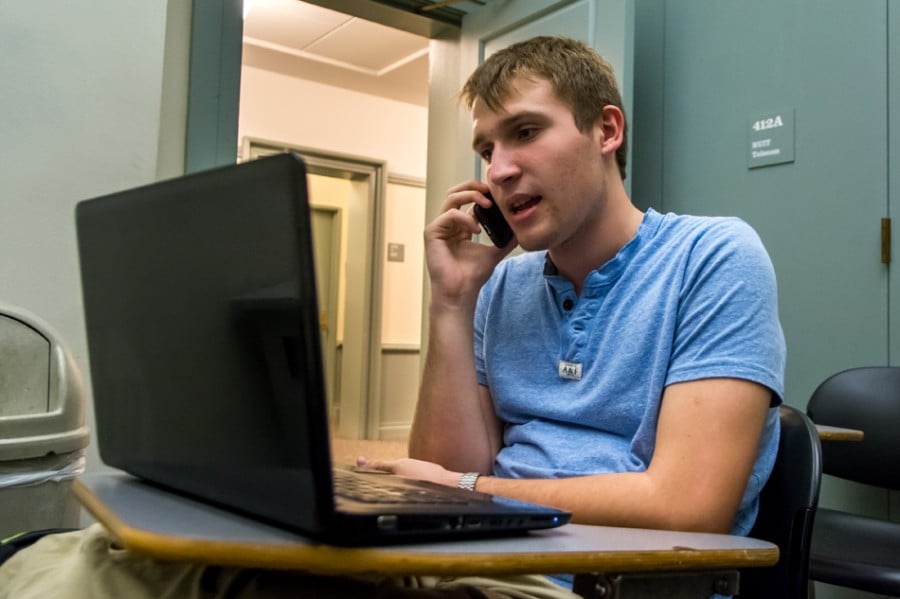 SESP freshman Kevin Corkran speaks on the phone with a Democratic party supporter Tuesday evening. The phone-banking session was sponsored by the NU College Democrats.