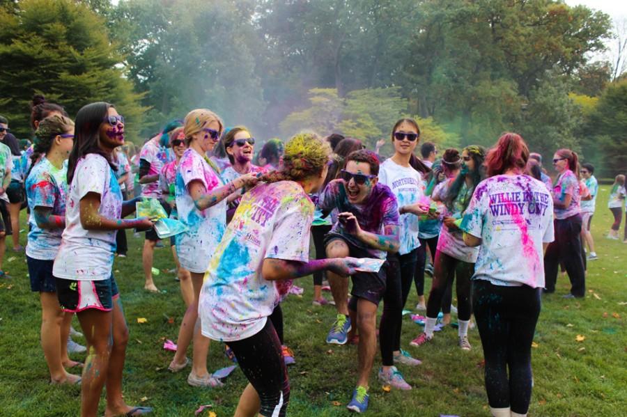 Students throw colored paint at each other at the third annual Color Roar on Deering Meadow. The event, which raised more than $1,500 for the Summer Internship Grant Program, was the first school-wide activity of Homecoming Week. 