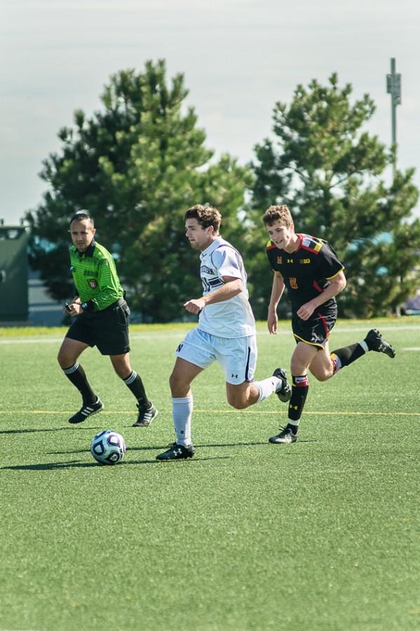 Jeffrey Hopson sprints up the field past a defender. The sophomore midfielder has been a solid contributor this season, starting every game and scoring 1 goal on 13 shots. 