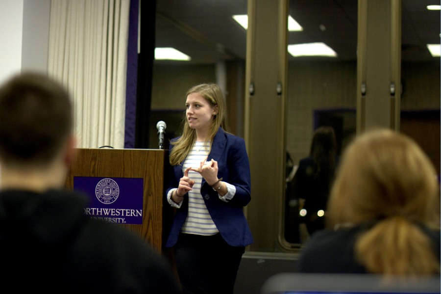 Northwestern Community Development Corps chair Taylor Billings discusses NCDC’s efforts to connect student groups at Senate Wednesday. Billings said the organization also wants to reduce over-programming on campus. 