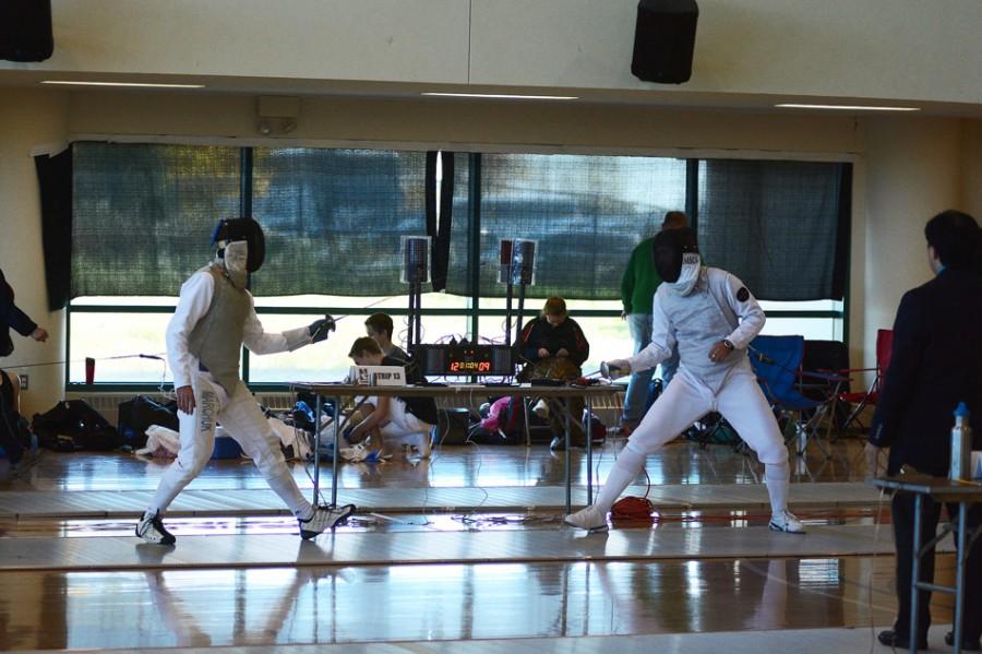 Two fencers square off in a dual meet earlier this season. The Wildcats struggled with an alternate scoring format this weekend, falling to the Fighting Irish 60-45.