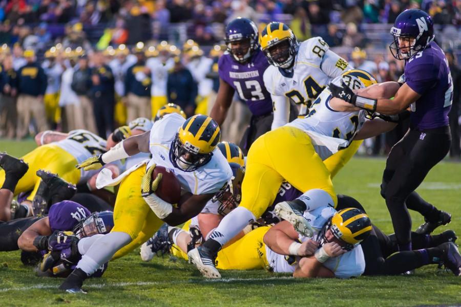 DeVeon+Smith+falls+into+the+end+zone+for+Michigans+only+touchdown.+The+running+backs+score+gave+the+Wolverines+a+lead+they+would+not+relinquish+in+an+eventual+10-9+victory.