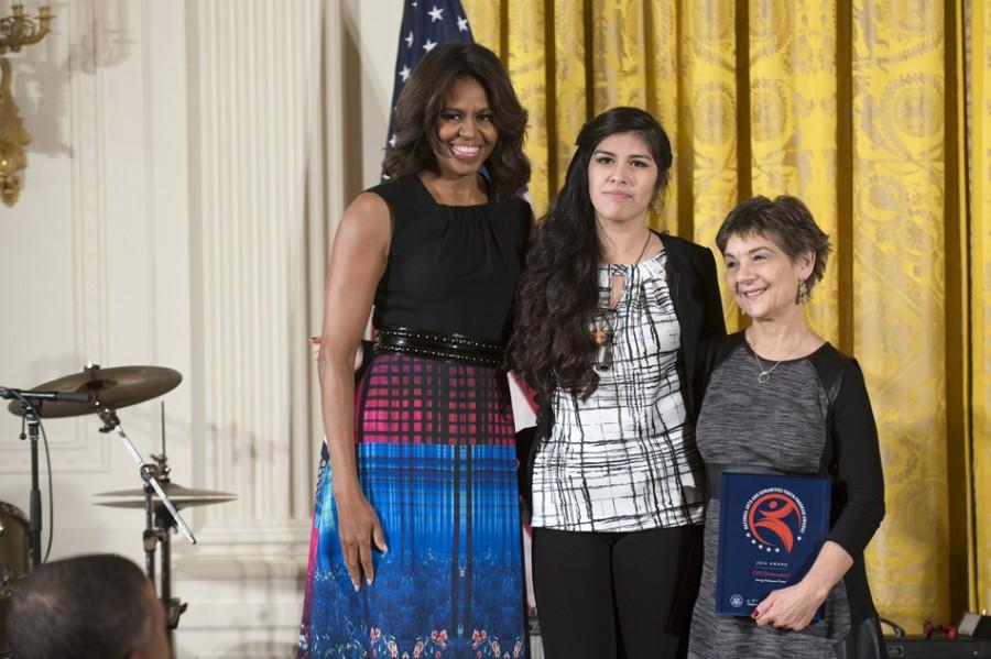 Evanston resident Marilyn Halperin, left, receives an award from First Lady Michelle Obama on Monday at a ceremony at the White House. Halperin accepted the award on behalf of the Chicago Shakespeare Theatre, which was honored for its after-school program that puts on productions of Shakespeare plays featuring students and teachers from Chicago Public Schools.
