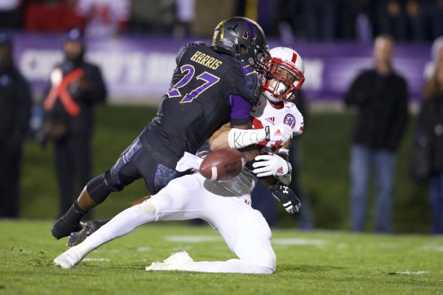 Sophomore cornerback Matthew Harris hits a Nebraska defender during Northwestern’s Oct. 18 game. Harris and fellow-corner Nick VanHoose will face a new challenge this weekend against pass-happy Notre Dame.