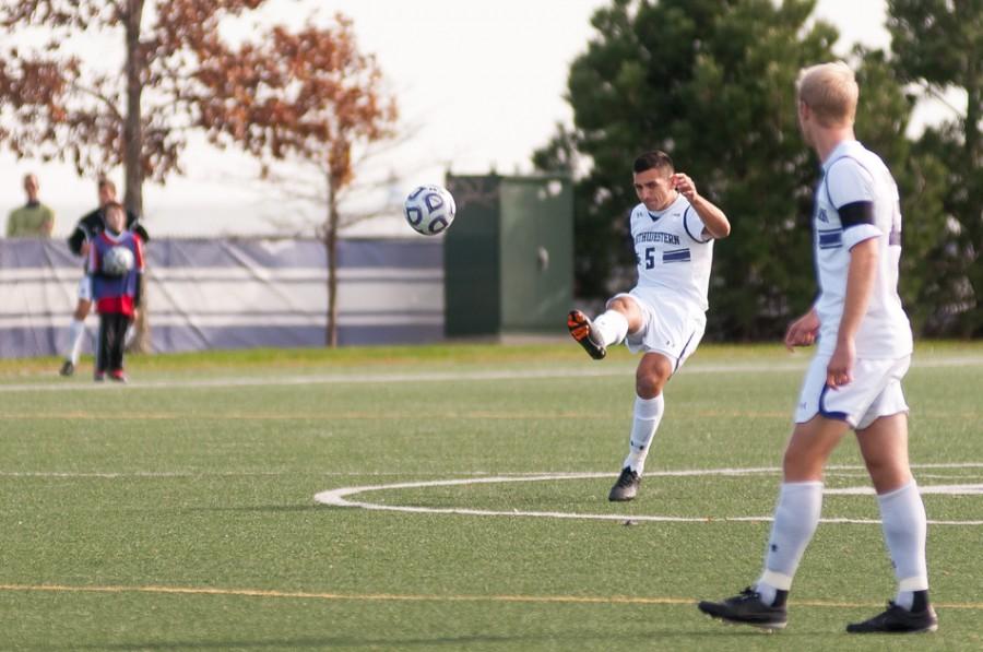 Nikko Boxall plays a ball forward. The senior centerback was named Big Ten Defensive Player of the Year for his role in leading the Cats’ stingy defense.
