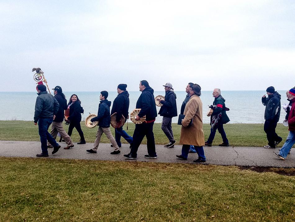 A+group+of+Evanston+and+Chicago+community+members+march+along+The+Lakefill+on+Saturday+afternoon.+The+crowd+gathered+for+a+commemoration+of+the+Sand+Creek+Massacre+held+by+the+Native+American+and+Indigenous+Students+Alliance.