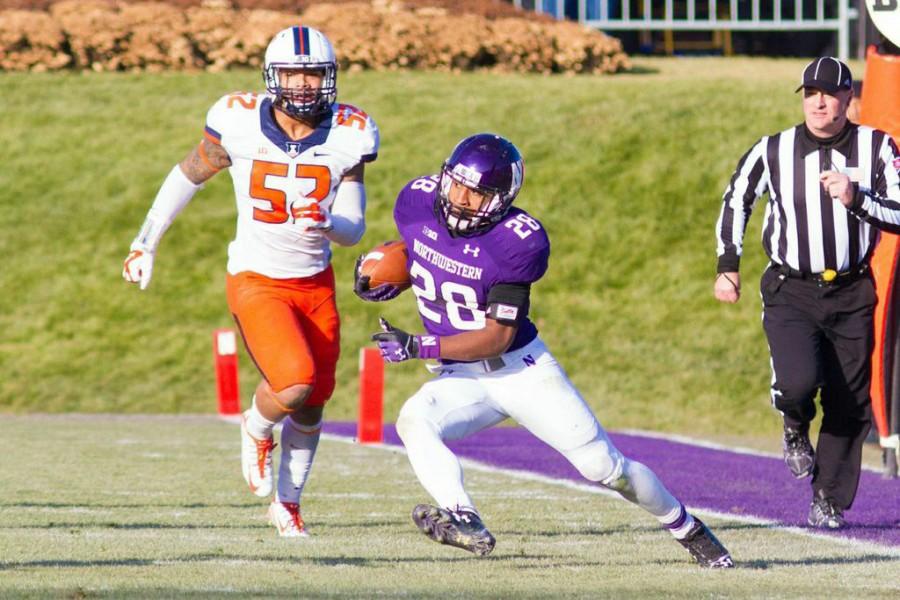 Justin Jackson cuts away from the sideline during Northwesterns loss to Illinois last Saturday. After a stellar freshman season, the running back is a key part of the Wildcats future in 2015 and beyond.