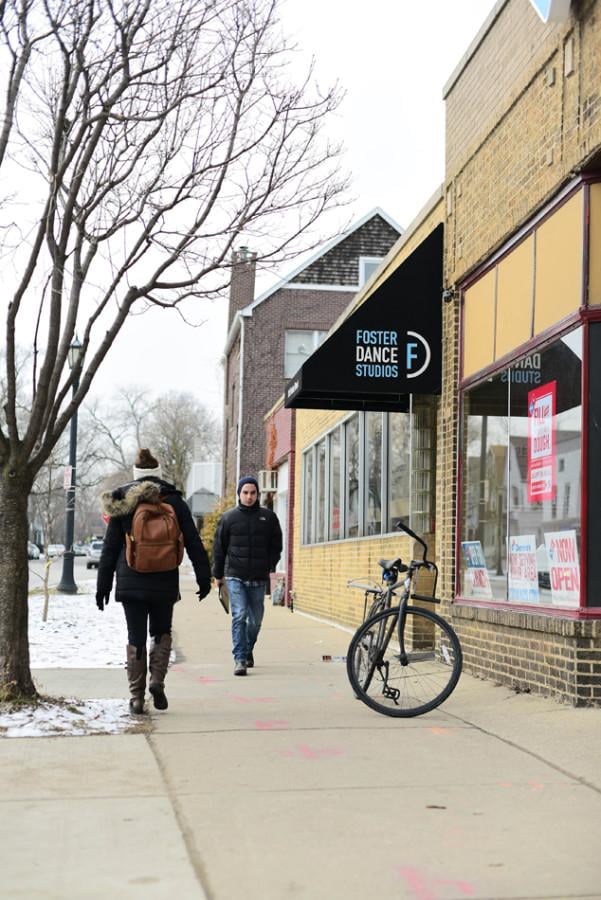 People walk past Foster Dance Studio, located at 915 Foster St., on Monday. The studio is expanding and hopes to see class enrollment increase as a result.