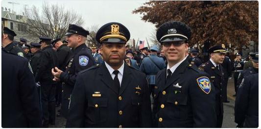 Evanston police Sgt. Tracy Williams and officer Nathaniel Basner are shown attending the funeral for New York police officer Wenjian Liu on Jan. 4. The two Evanston officers joined thousands of others from around the nation in paying their respects to Liu, who was slain on the job last month.