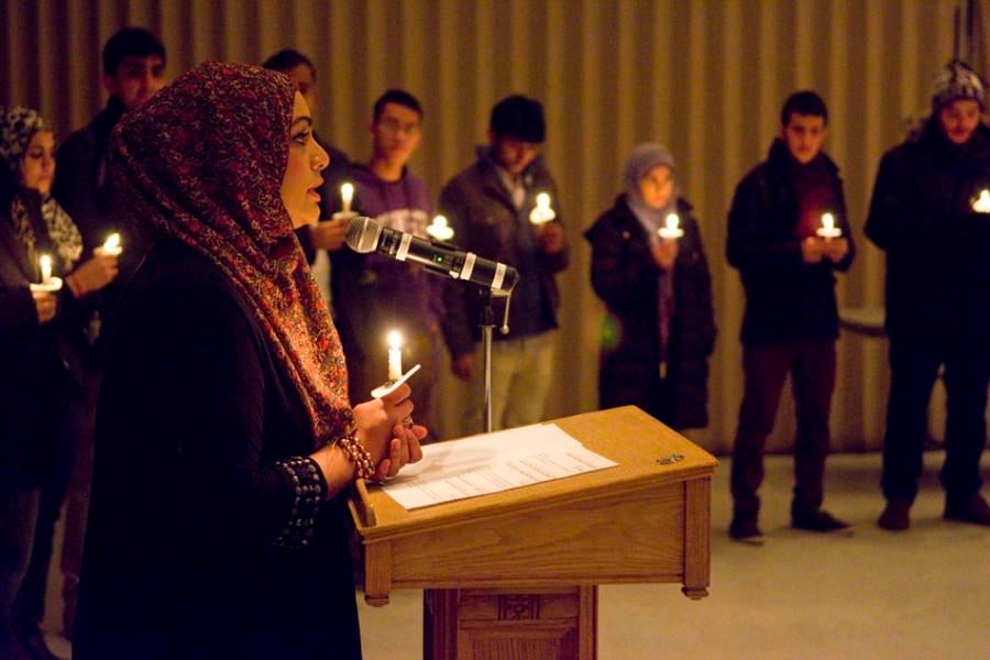 Tahera Ahmad, associate chaplain and director of interfaith engagement, speaks during the vigil held in honor of victims of the Taliban attack in a school in Peshawar, Pakistan.
