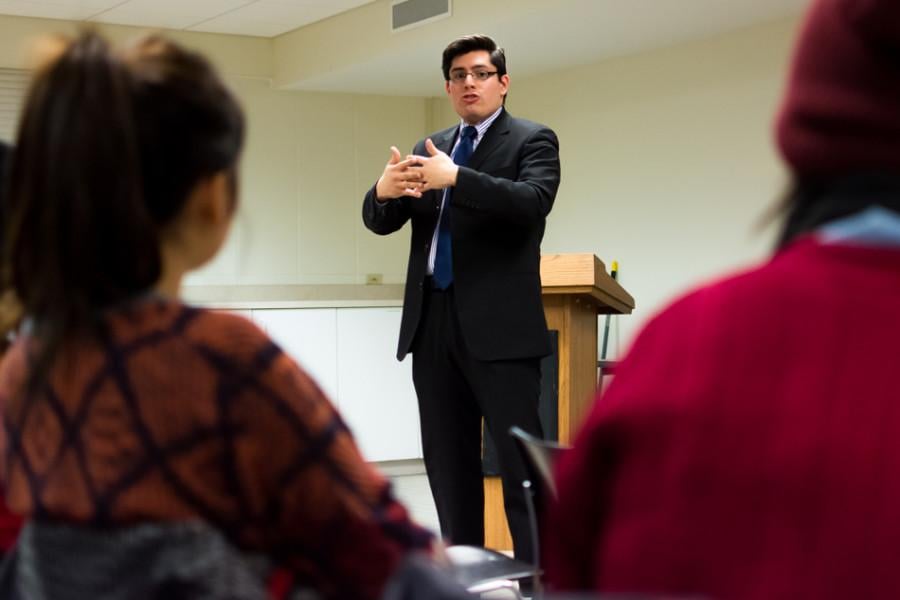 Carlos Rosa speaks about the importance of neighborhood relationships. Rosa, a community organizer running for alderman, spoke Thursday at the Sheil Catholic Center.
