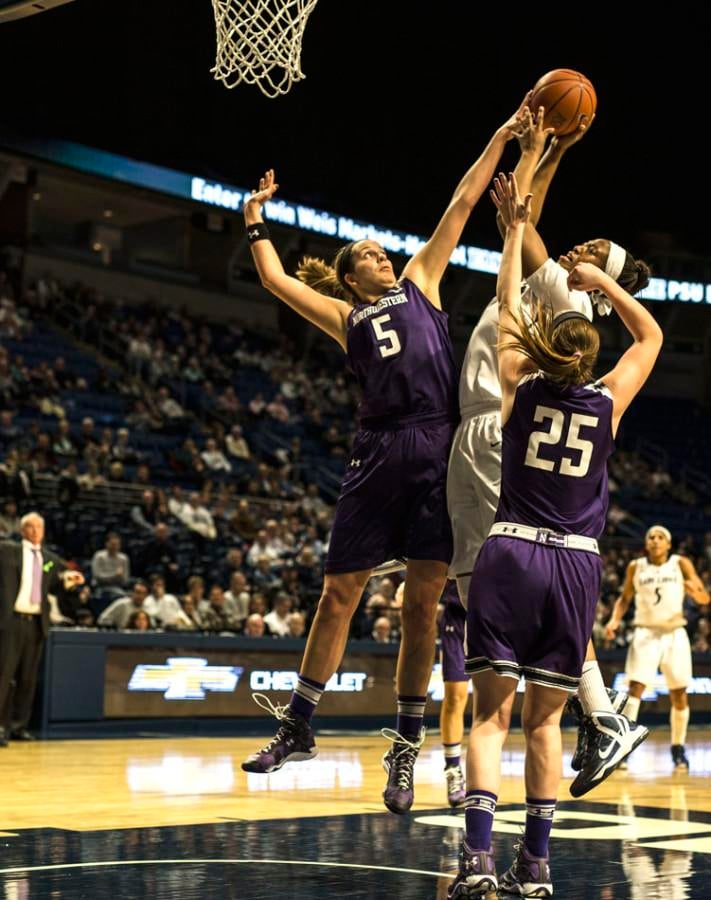 Alex Cohen goes for the block. The senior center fouled out late in the second half, allowing Penn State key rebounding chances against Northwestern’s four-guard lineup.
