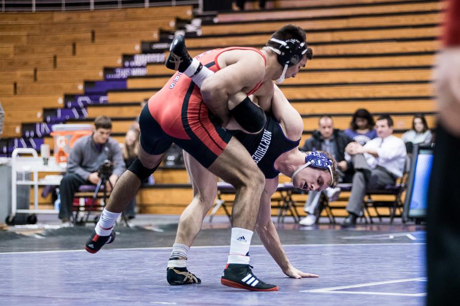 Wisconsins+Ricky+Robertson+puts+Northwesterns+Mitch+Sliga+in+a+precarious+position.+Trouble+spots+were+a+familiar+theme+for+the+Wildcats+on+Friday+night%2C+as+three+NU+wrestlers+were+pinned+in+a+30-16+loss+to+the+Badgers.