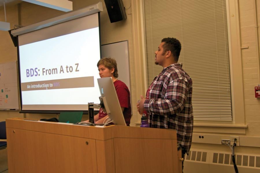 Weinberg juniors and NU Divest members Alexa Klein-Mayer and Hazim Abdullah-Smith lead the group’s workshop about BDS. Over 40 people attended the event in Fisk 311 on Thursday.