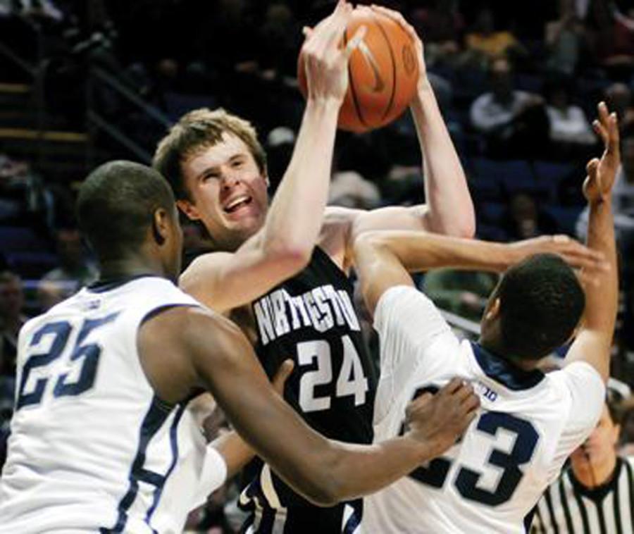 John Shurna battles his way through two defenders. The former Northwestern standout was instrumental in the Wildcats’ failed attempt at an NCAA Tournament bid in the 2011-2012 season. 