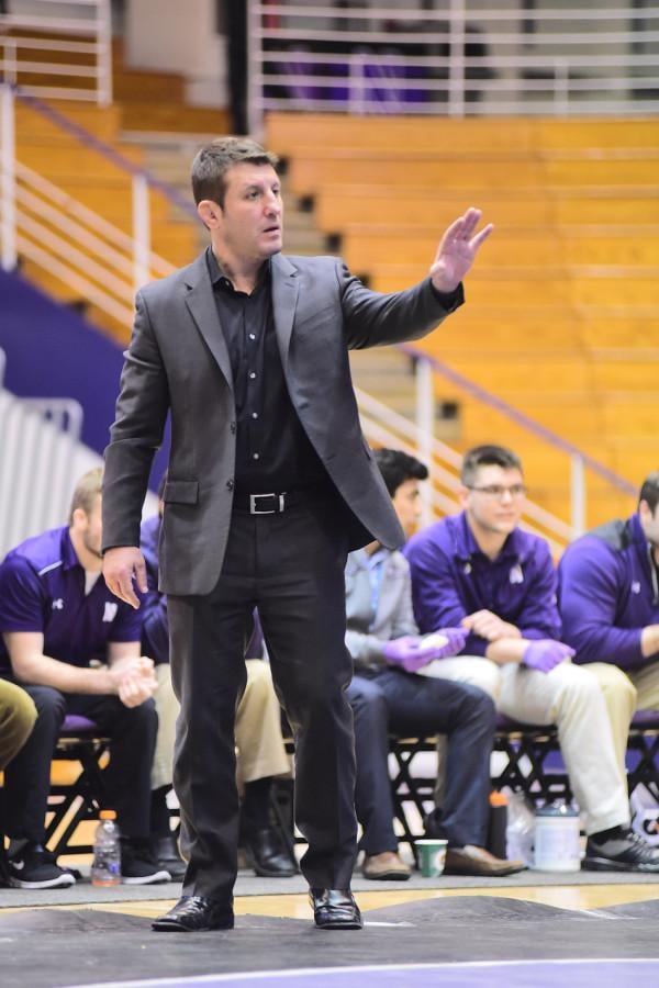Drew Pariano dictates the action. Northwestern’s coach is not one to beat around the bush, as he takes a blunt approach when instructing his wrestlers.