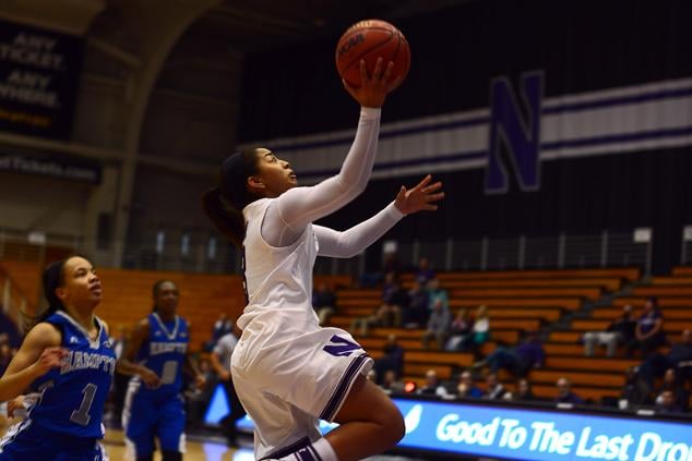 Ashley Deary goes in for the layup. The sophomore guard was the only Wildcats starter to not score in double-digits Sunday night, but her nine assists played a large role in Northwestern’s thriving offense.