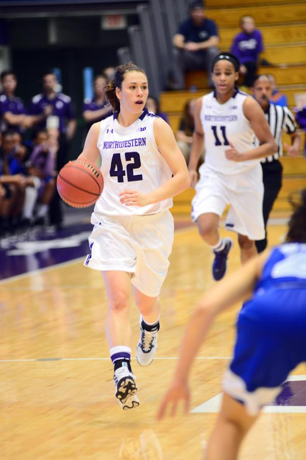Guard Karly Roser dribbles up the court. The senior started Sunday’s game against Illinois and helped Northwestern overcome the Fighting Illini after sophomore Christen Inman was a late scratch.