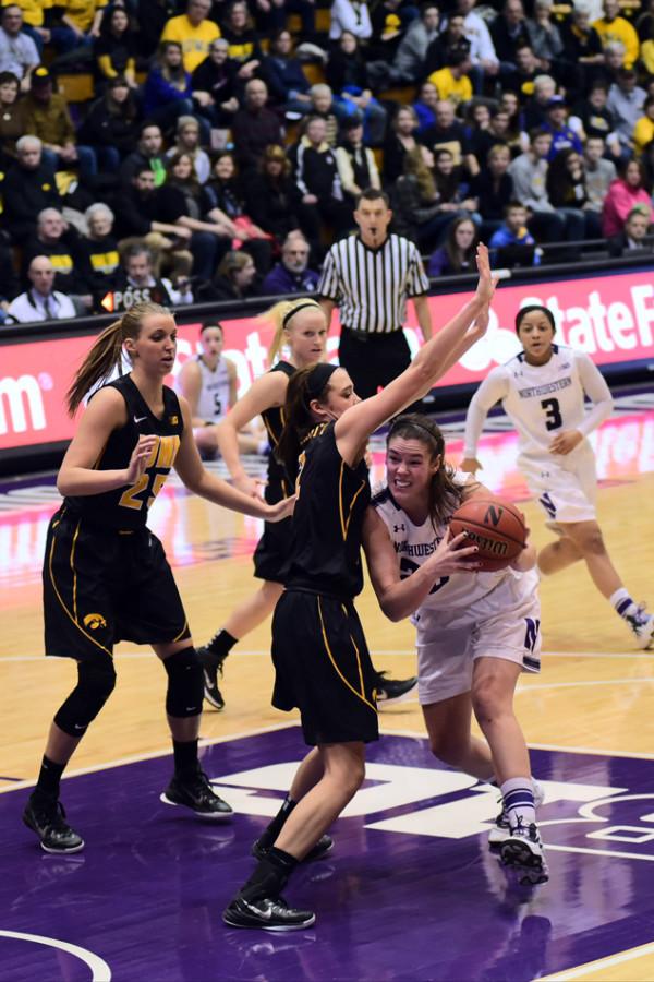 Maggie Lyon weaves her way through the paint. The junior guard scored 15 points in Sunday’s 86-83 overtime win, none more important than the 2 she produced with seconds left in regulation to tie the contest.