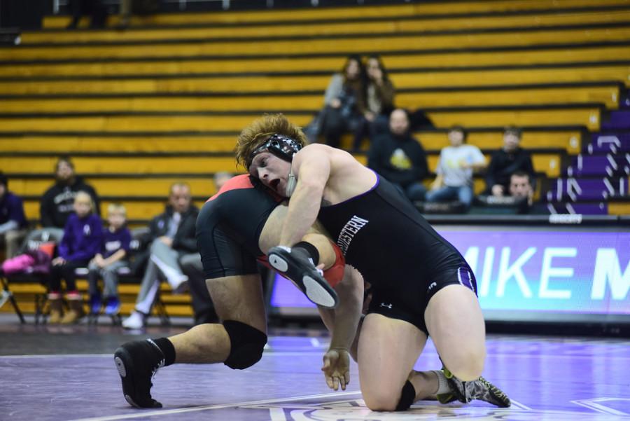 Mike McMullan shows his strength. The senior heavyweight will be competing in the final home match of his Northwestern career on Friday.