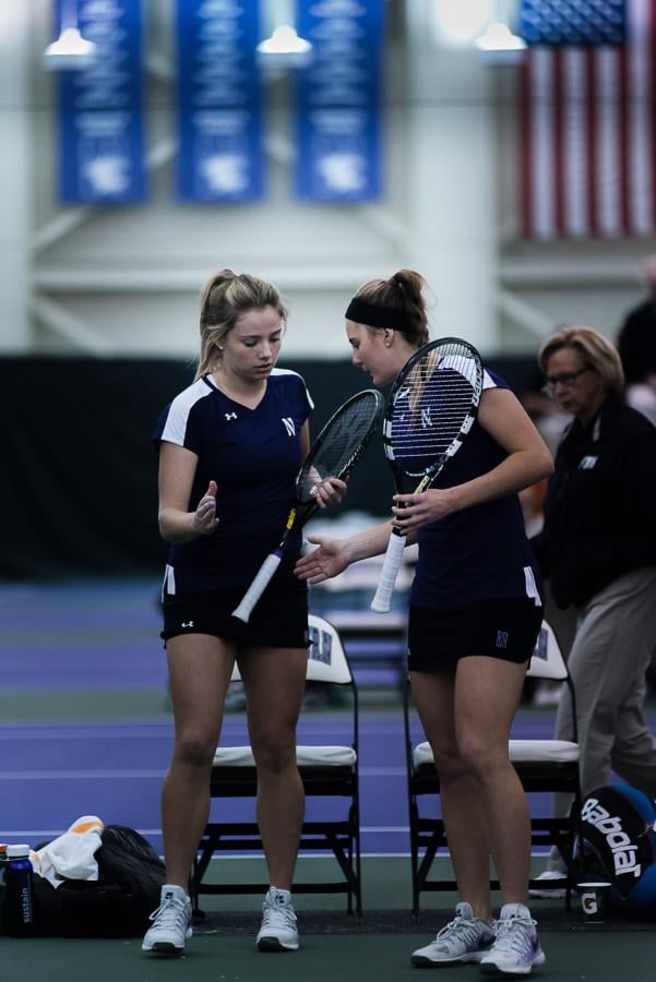 Alex Chatt and Brooke Rischbieth go in for a high-five. Despite a significant drop in the rankings, the Wildcats feel like they have found their way after some early-season struggles.  