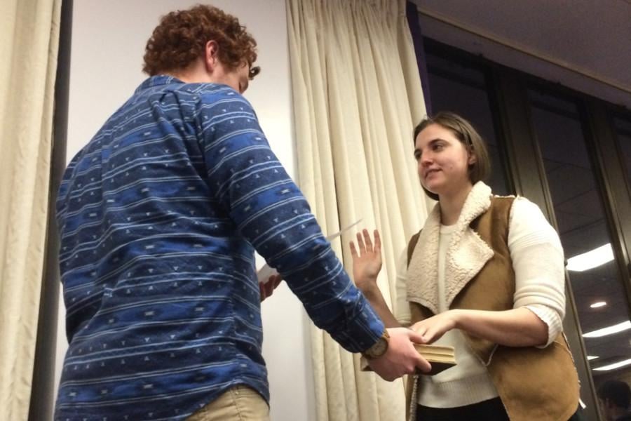 Speaker Noah Star swears in Weinberg junior Mackenzie Schneider as vice president for A-status finances at Senates March 11 meeting. She will oversee funds given to A-status student groups​.