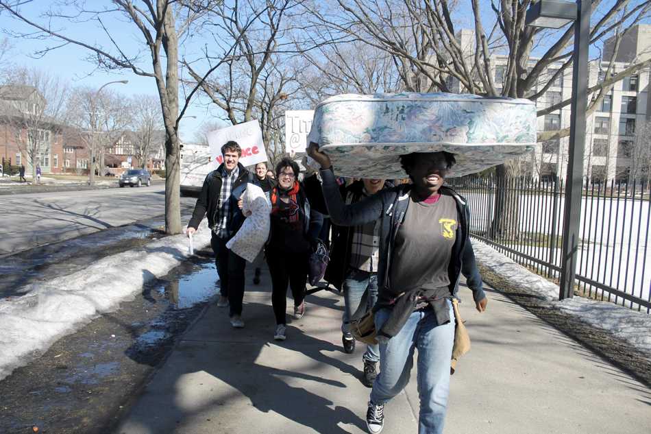Students+carry+mattresses+and+pillows+to+the+Rebecca+Crown+Center+on+Monday+morning+to+protest+a+Northwestern+professors+opinion+piece+on+relationships+between+professors+and+students.+About+30+students+marched+and+posted+signs+at+the+Crown+Center.