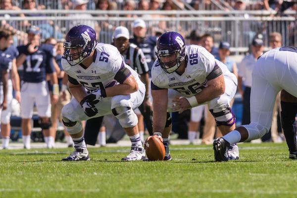 Junior Matt Frazier and senior Brandon Vitabile prepare for the snap. Strength and conditioning is of extra importance to Northwestern’s undersized offensive line.