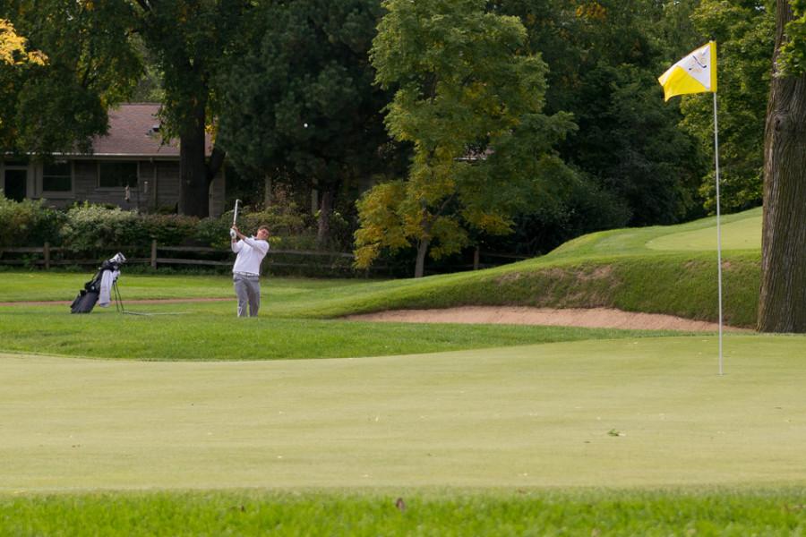 Bennett Lavin shoots his way out of a bunker. The senior will be critical in helping Northwestern navigate a competitive field and difficult course this weekend.