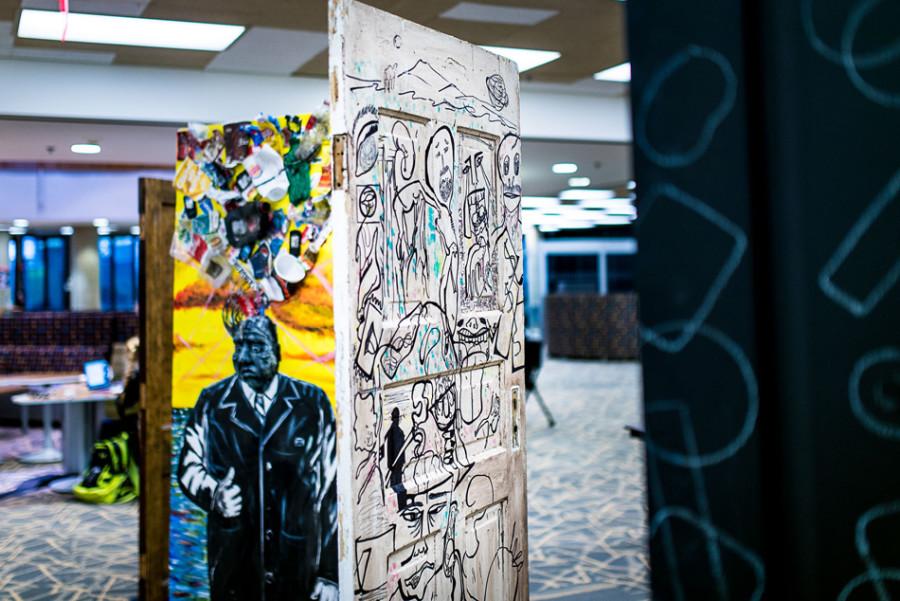 The “Opening Doors” art installation opened in the South Tower of University Library on Friday. The installation features murals on four recycled doors designed by students and artists.