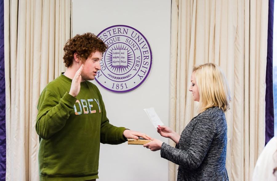 Noah Star is sworn as the new Associated Student Government president by outgoing President Julia Watson at Senate on Wednesday. Star’s running mate, Christina Kim, was also sworn in as ASG’s executive vice president.