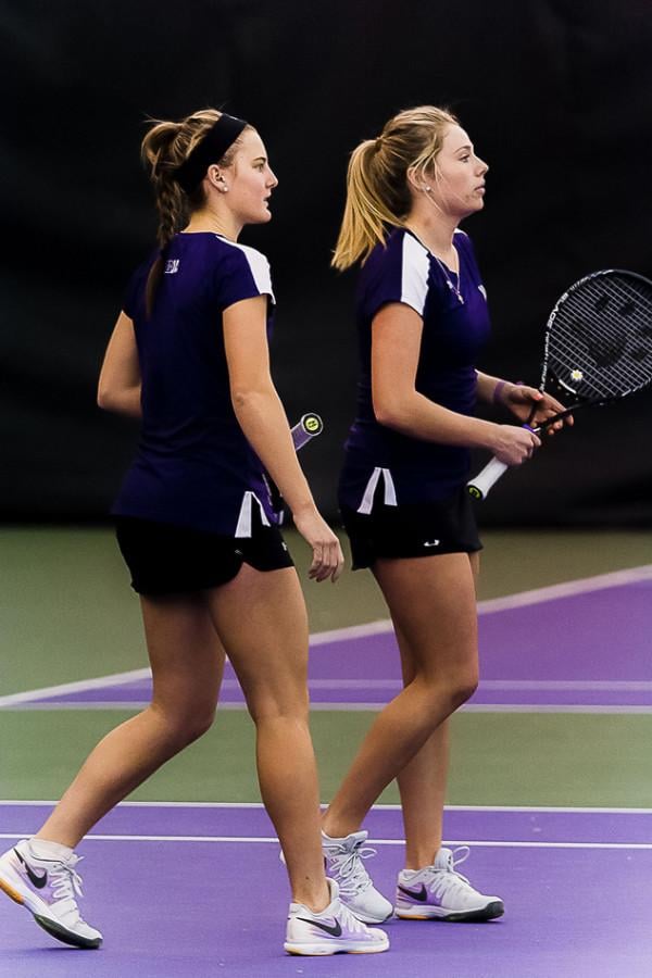 Sophomore Brooke Rischbieth and freshman Alex Chatt talk strategy during a doubles match. Each went undefeated during Northwestern’s weekend play.