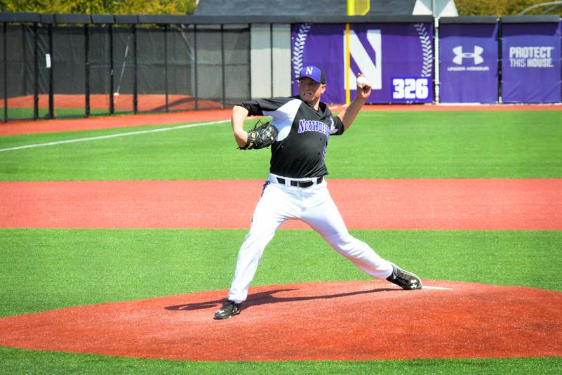 Matt Portland fires a pitch toward home plate. The junior pitched all nine innings Saturday in Northwestern’s lone win of the series.