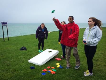 Volunteers from Northwestern University to Benefit Special Olympics play cornhole Saturday with people with special needs at the first-ever Special Needs Awareness Field Day Palooza. The event, co-sponsored by NUSO and Evanston Township High School’s Emerge leadership program, took place on the south end of the Lakefill.