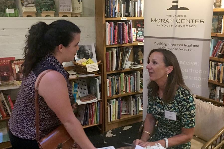 Northwestern alumna Jeanne Bishop signs a copy of her book, Change of Heart, a story about the 1990 Winnetka murder of Bishops sister and brother-in-law. Bishop spoke about forgiveness and healing at Bookends & Beginnings Tuesday evening and led a discussion about criminal justice.