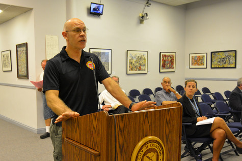 Jason Hays, an Evanston firefighter, speaks to aldermen Monday in opposition to budget-balancing strategies that cut pay for city employees. Aldermen will consider proposed fiscal solutions, including a furlough day and a city hiring freeze, during future meetings.