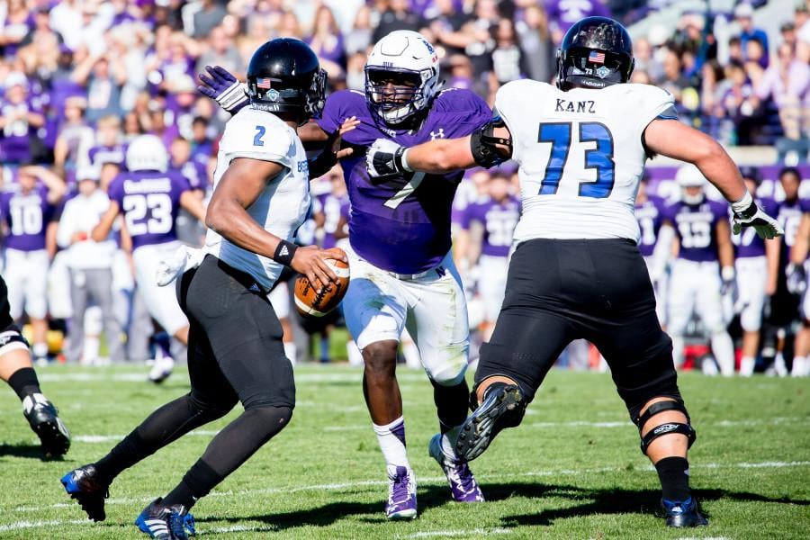 Junior defensive end Ifeadi Odenigbo fights through a blocker to get to Eastern Illinois’ quarterback. The lineman has been a catalyst for Northwestern’s early defensive improvement.