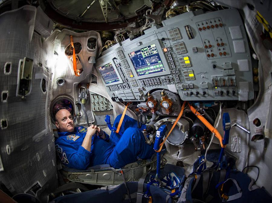 Astronaut+Scott+Kelly+lounges+inside+a+Soyuz+simulator.+Kelly+went+into+space+in+March+and+will+become+the+first+American+to+stay+at+the+International+Space+Station+for+more+than+215+days.
