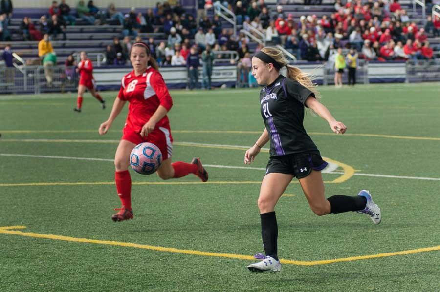 Junior forward Addie Steiner takes on a defender. The forward continued her successful season with two decisive goals in Thursday’s game against Maryland. 

