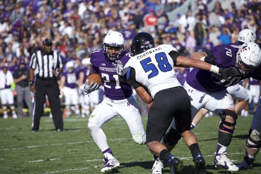 Running back Justin Jackson scampers past the Eastern Illinois defense. Jackson found the end zone for the first time this season Saturday afternoon, contributing to the Wildcats lopsided victory. 