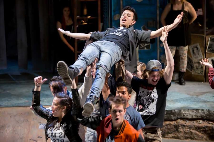 Charlie Oh, who is hoisted up, and the cast rehearse for “American Idiot.” The show opens on Oct. 16 at the Ethel M. Barber Theater.