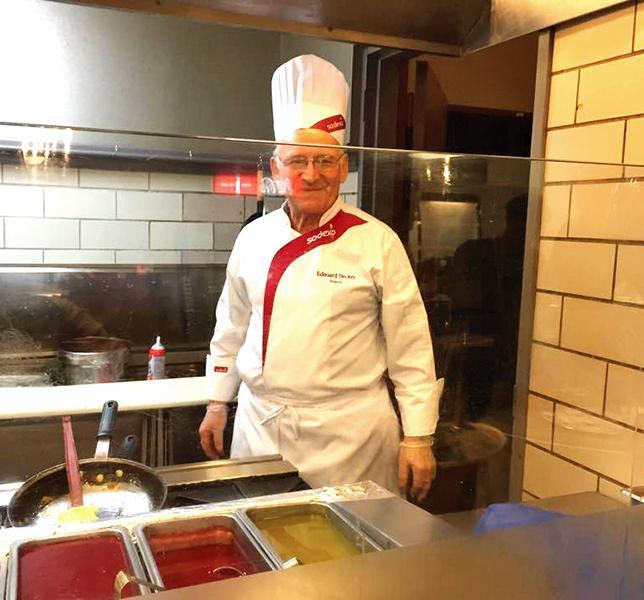Edouard Becker stands behind the counter at Norris University Center on Tuesday. Becker is Northwestern Dining’s Global Chef of the year. The program brings chefs from around the world to prepare food in University dining halls.