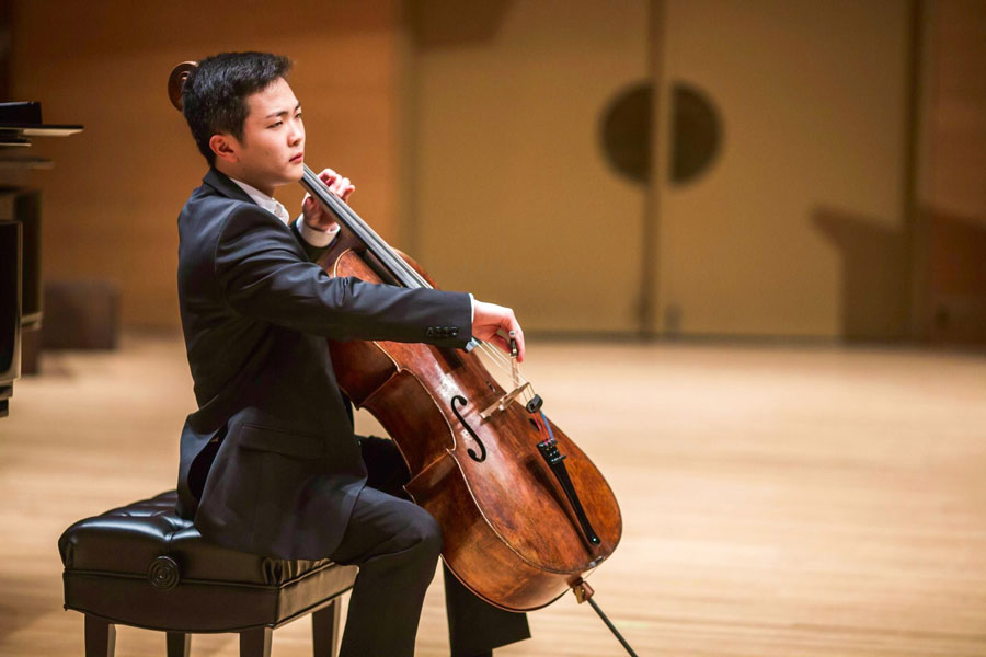 Brannon+Cho+plays+his+cello+on+stage+during+Minnesota+Orchestra+Young+Artists+Competition+finals+earlier+this+May.+This+month%2C+the+Bienen+junior+took+second+place+in+the+Naumburg+International+Cello+Competition.