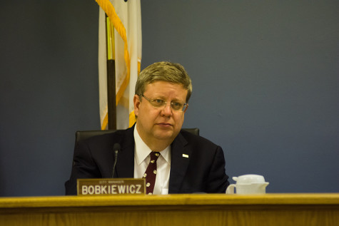 City manager Wally Bobkiewicz attends a City Council meeting. He told aldermen at a special City Council meeting Saturday that Evanston needs to prepare for likely state funding cuts and a potential property tax freeze across Illinois.