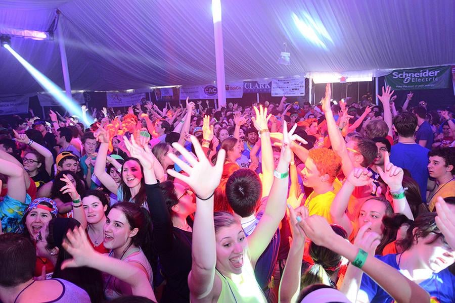 Students put their hands in the air during Block 7 of Dance Marathon. This year, organizers expanded opportunities for volunteering in an effort to be more inclusive of low-income students.